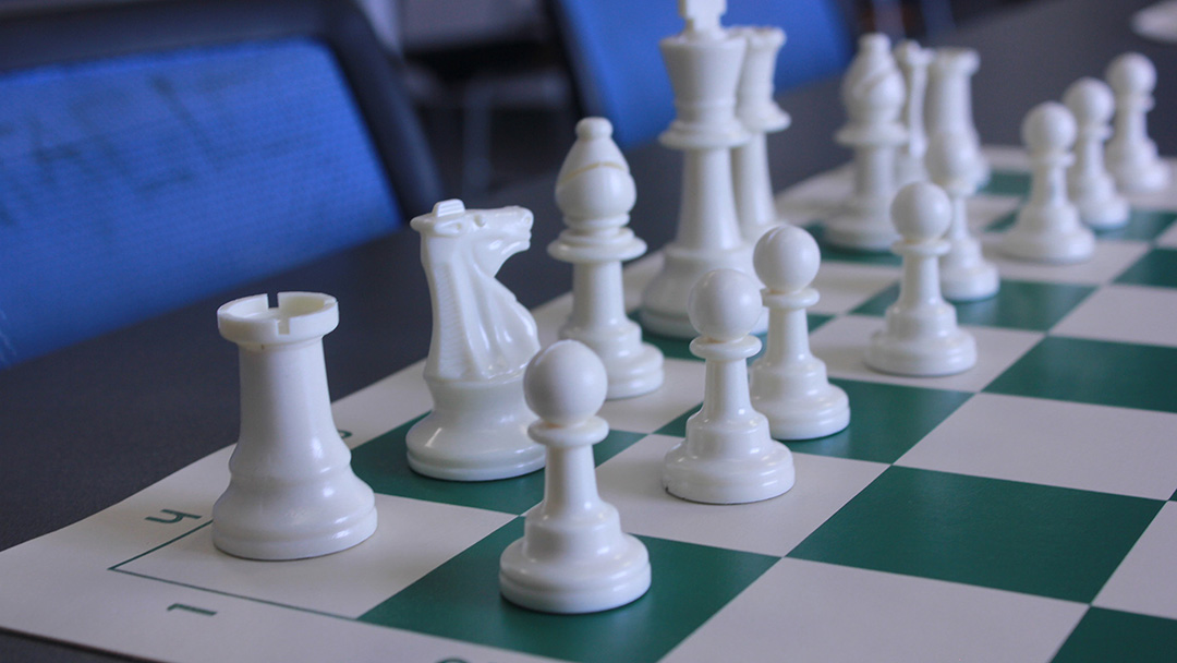 A chess board with the pieces set up for a game